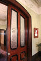 Pocket door with faux-painted wood grain at Edward Steves Homestead Museum. San Antonio, TX.