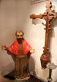 Spanish statue of St Joseph & carved cross in museum at Mission San José. San Antonio, TX.