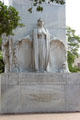 Female symbol of Texas holding shields of Texas & United States on north panel of Alamo Cenotaph. San Antonio, TX.