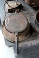 Puritan waffle iron atop stove in Walton-Smith log cabin at Pioneer Museum. Fredericksburg, TX.