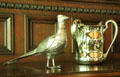 Decorative silver bird & three-handled pitcher on sideboard in breakfast room at McFaddin-Ward House. Beaumont, TX.