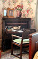 Desk in bedroom with floral wallpaper at McFaddin-Ward House. Beaumont, TX.