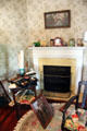 Fireplace in Florence Chamber's bedroom with her painting supplies at Chambers House Museum. Beaumont, TX.