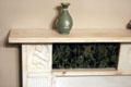 Carved marble mantelpiece with cameo-style vase at McCulloch House. Waco, TX.