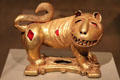 Cast gold sword ornament in form of lion by Assante culture of Ghana at Dallas Museum of Art. Dallas, TX