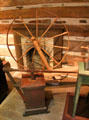 Spinning wheel & butter churn at Bullock Texas State History Museum. Austin, TX.