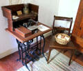 Treadle sewing machine in Baetge House at Conservation Plaza. New Braunfels, TX.