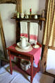 Washstand with pitcher, basin & towels in Baetge House at Conservation Plaza. New Braunfels, TX.