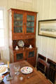Glass fronted cupboard from home in San Antonio at Museum of Texas Handmade Furniture. New Braunfels, TX.