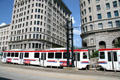 UTA Trax streetcars run in front of Boston & Newhouse Buildings. Salt Lake City, UT.