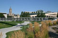 Footbridge across garden of Salt Lake Public Library with City Hall tower beyond. Salt Lake City, UT.