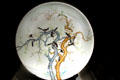Porcelain plate with magpies on tree branch from China at Utah Museum of Fine Art. Salt Lake City, UT.