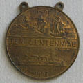 Souvenir medal with Jamestown settlers' ships & Battleship USS Virginia from Jamestown Exposition at Moses Myers House museum. Norfolk, VA.