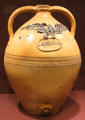 Stoneware jug with applied eagle & owner's name by Julius Norton Pottery of Bennington, VT at Bennington Museum. Bennington, VT.
