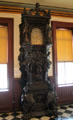 Elaborately carved tall clock at Vermont History Museum. Montpelier, VT.