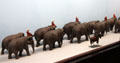 Parading elephants, some of 4,000 circus parade figures carved in one-inch=one-foot scale in circus building at Shelburne Museum. Shelburne, VT.