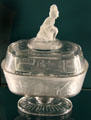 Frosted pressed glass Westward Ho covered dish by Gillinder & Sons of Philadelphia, PA at Shelburne Museum. Shelburne, VT.