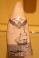 Scrimshaw whale tooth with whaling ship & hunt at Shelburne Museum. Shelburne, VT.