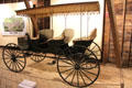 Three-seat surrey from America in Round Barn at Shelburne Museum. Shelburne, VT.