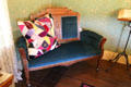 Sofa with carved back in farm house parlor at Billings Farm & Museum. Woodstock, VT.
