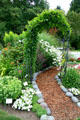 Flower beds & garden arc at Hovander Homestead. Ferndale, WA.