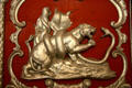 Carving of tiger battling a snake on red & silver circus wagon at Circus World Museum. Baraboo, WI.