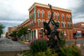 Looking up Main St. from Indians playing LaCrosse sculpture. La Crosse, WI.