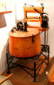 Early mechanical sealed wooden tub washing machine & wringer at West Virginia State Museum. Charleston, WV.