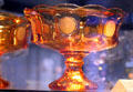 Coin glass footed compote in amber at Fostoria Glass Museum. Moundsville, WV.