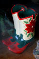 Ceramic Christmas cowboy boots in shop window. Cody, WY.