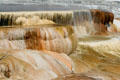 Water falls over the crystals of Minerva Terrace of Mammoth Hot Springs at Yellowstone National Park. WY.