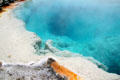 White minerals deposited on edge of geyser pool at West Thumb in Yellowstone National Park. WY.