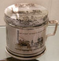 Transfer-printed shaving mug showing locomotives Stephenson's Rocket plus Braithwaite & Ericsson's Novelty competing in trials for Liverpool 7 Manchester Railway by Herculaneum Pottery, Toxteth, Liverpool at Walker Art Gallery. Liverpool, England.