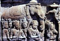 Carved stone relief of elephant & attendants at Borobudur. Indonesia