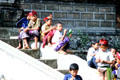 Young boys sit on temple steps. Bali, Indonesia.