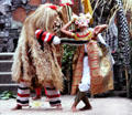 Evil tries to overcome innocent youth in Barong dance. Bali, Indonesia.
