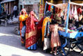 Women buying items from street vendor in Mandawa. Mandawa, India