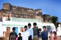 Kids pose in front of palace at Roopangarth. India
