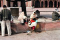 People resting outside of a Mosque at Fatehpur Sikri. India.
