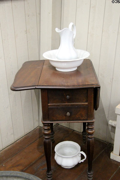 Simple wash basin & pitcher, commode & wooden stand at Van Gogh House in Cuesmes. Mons, Belgium.