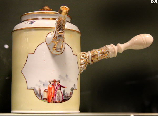 Meissen porcelain chocolate pot decorated in yellow with imaginary Chinese scenes in white quatrefoils (c1740-45) at Gardiner Museum. Toronto, ON.