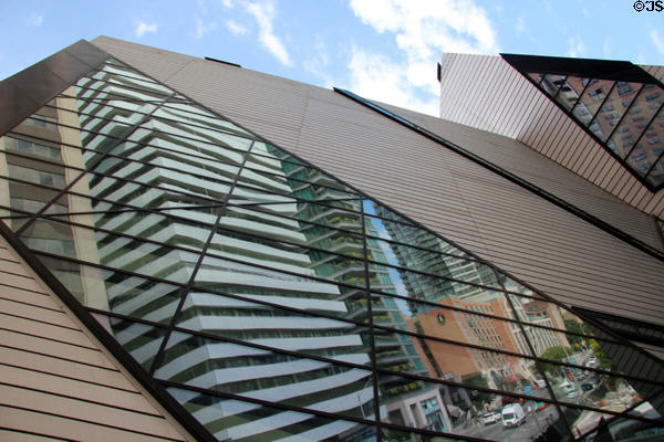 Chin Crystal windows of Royal Ontario Museum reflect Bloor Street highrises. Toronto, ON.