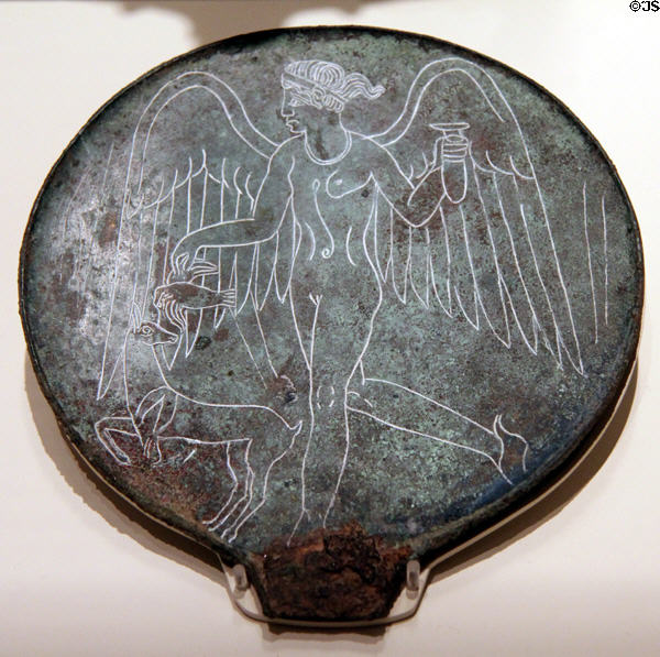 Etruscan bronze mirror back (c300-200 BCE) depicting Lasa goddess of fate holding an alabastron at Royal Ontario Museum. Toronto, ON.