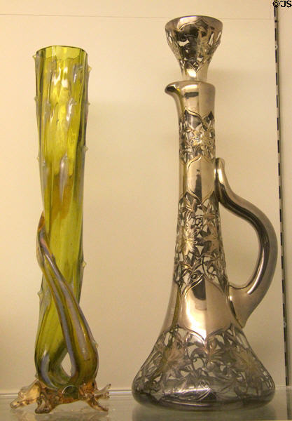 Cactus-form vase c1890 from England & silver overlaid glass decanter (1900-10) from England or USA at Royal Ontario Museum. Toronto, ON.