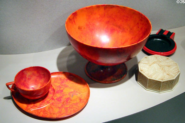 Plastic English picnic set (1927-32) , French powder box (1930) & ashtray (1934) from HMS Queen Mary at Royal Ontario Museum. Toronto, ON.