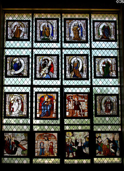 Collection of religious stained-glass panels mounted as one large window at Ariana Museum. Geneva, Switzerland.