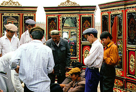 Ornate cabinets for sale at the Sunday market, Kashgar. China.
