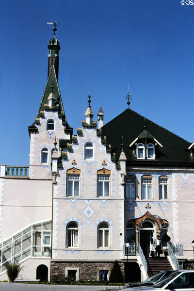 Mediterranean styled hotel building (1870) with tower & tiled walls on banks of Elbe. Meissen, Germany.