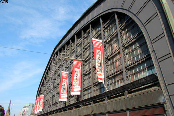 Posters over entrance ironwork to Central Rail Station. Hamburg, Germany.