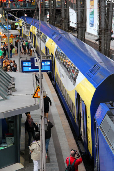 Passengers boarding double-decker train at Central Rail Station. Hamburg, Germany.